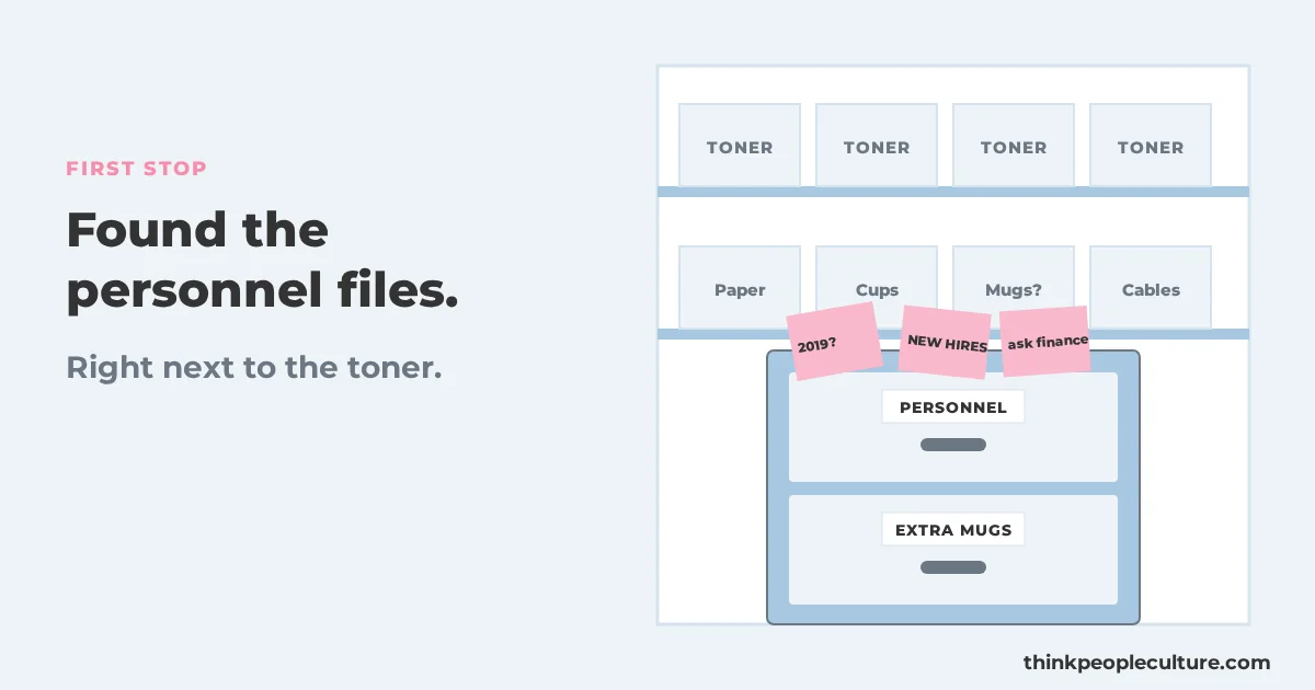 Filing cabinet in a supply closet next to toner boxes with a drawer labeled personnel files and folders marked with sticky notes